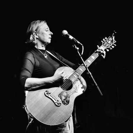 musician Jill Roger playing guitar